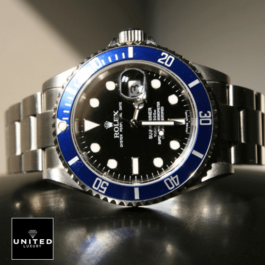 Rolex Submariner Date 16610 Black Dial Oyster Replica on the table