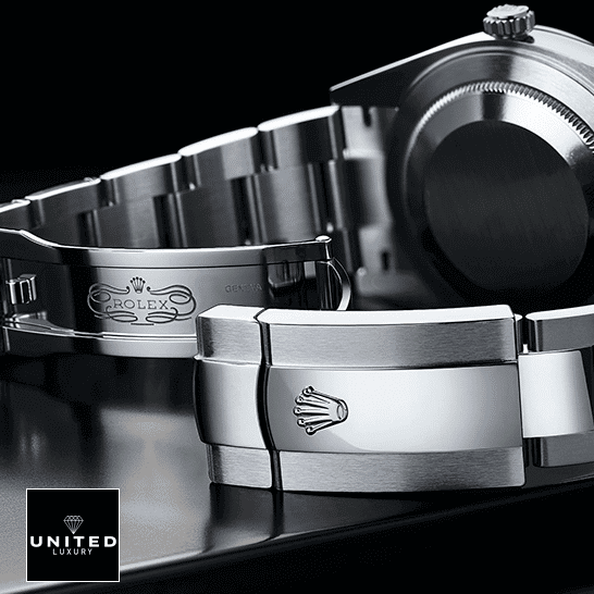 Rolex Datejust 179179 Replica Open Fold Clasp on the Rolex Logo on the table